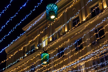 Christmas lights on a city streets. Christmas urban decorations