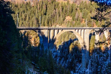 Fotobehang Landwasserviaduct View of Wiesen Viaduct, Rhaetian railway, Graubunden in Switzerland at winter