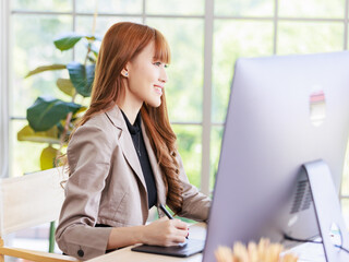 Asian professional successful young female businesswoman creative graphic designer in casual...