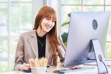 Asian professional successful young female businesswoman creative graphic designer in casual...
