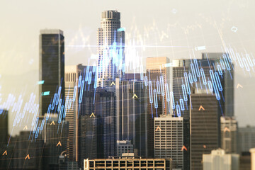 Double exposure of abstract creative financial chart hologram and world map on Los Angeles city skyscrapers background, research and strategy concept