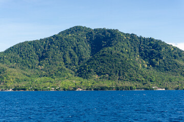 Fototapeta na wymiar Popular tourist destination in Aceh, Indonesia. View of Sabang island from the boat.