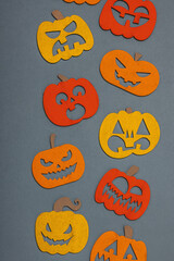 Funny Halloween background. Traditional colorful fall pumpkins with different faces