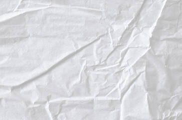 Creative background with scattered overlay of crumpled white paper.	