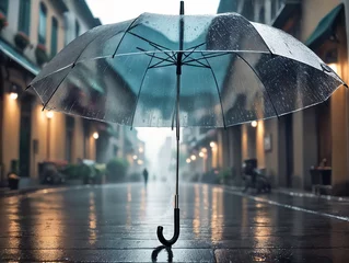 Fotobehang Transparent umbrella in rain on a city street, on paving stones © ArtEvent ET
