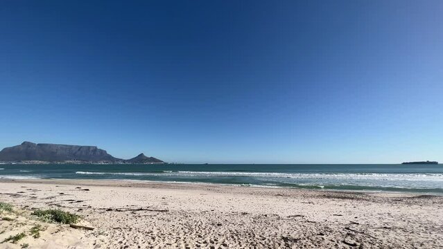 Long white sandy beach with views of Table Mountain