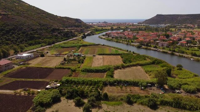 Countryside of Bosa aerial flying next to river Temo, Sardinia, forward, day