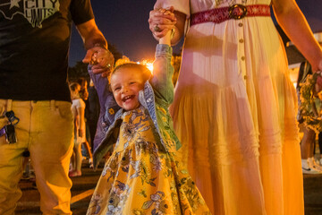 Fototapeta premium Toddler enjoys time with family at the fair