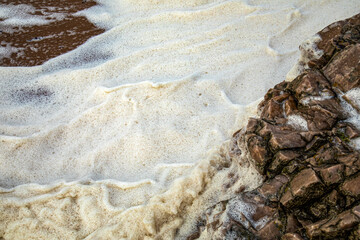 Very stormy sea creating foam - sea snow caused by storm