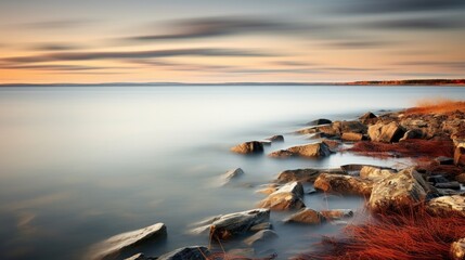 An impressionistic photograph capturing the scenic shoreline of Hudson Bay, Churchill, Manitoba, Canada. This image was created using a panning technique with a slow shutter speed - obrazy, fototapety, plakaty