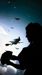 Fototapeta premium the black shadow of a girl in profile with Tarot cards in hand cards in the background of clouds flying on a broomstick witch and bats