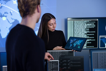 Cyber security team working in a Cyber Security Operations Center SOC to protect systems and...