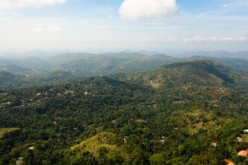 Naklejka premium Mountain peaks covered with forest. Slopes of mountains with evergreen vegetation. Sri Lanka.