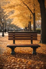 park bench covered in fallen leaves with an empty seat
