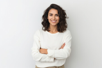 beautiful woman smiling with arms folded on white background - Powered by Adobe