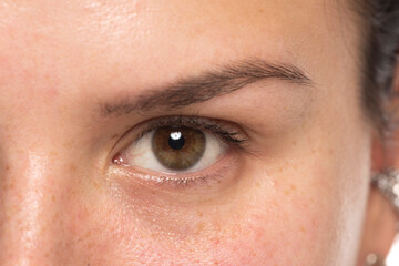 Fototapeta na wymiar Close-up of a natural female eye with no makeup