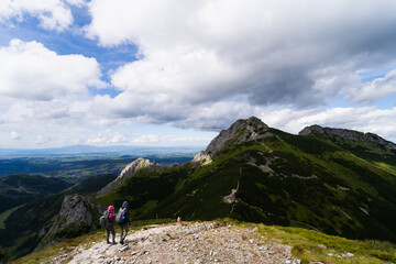 Fototapeta premium Travelers tourists go to Mount Giewont in the Polish Tatras.