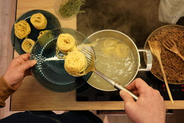 pasta pasta nests are cooked in a pot of hot water, pasta cooking, tagliatelle process