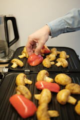 grilled mushrooms and red peppers in a grill pan