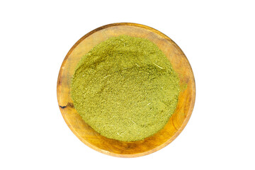 Moringa sohajna leaves powder in a wooden bowl