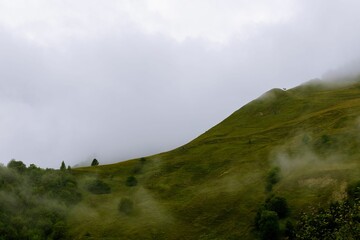 Stunning view of mountains covered in lush grass in Kvesheti-Kobi, Georgia