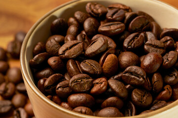 Black coffee and coffee beans on Wooden table