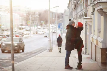 Foto op Plexiglas Young couple walking through the winter © alexkich