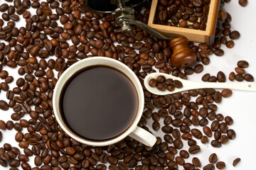Black coffee and coffee beans on white background