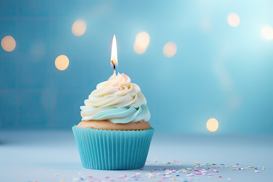 Birthday cupcake with candle on blue background with bokeh, Delicious birthday cupcake on table on light background, AI Generated