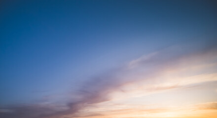 Minimalistic evening sky with clouds and sun glare, looking up at the sky in the evening - obrazy, fototapety, plakaty