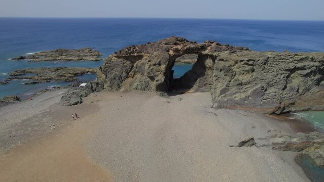 Fuerteventura Island, Ajui: aerial view traveling out over the Jurado arch on a sunny day with beautiful colors.