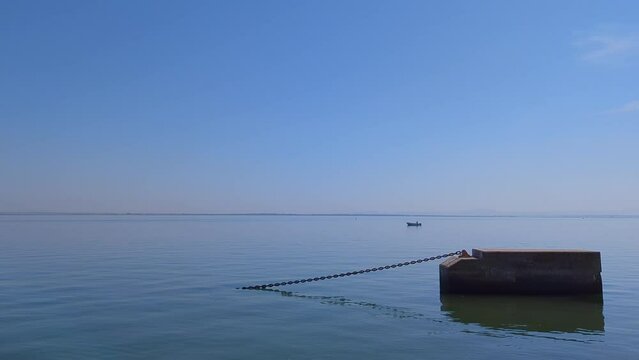 Calm River Tagus (Rio Tejo) panaroma at golden hour with a beautiful blue sky, still water and the silhouette of a distant lone fisherman - 4Ktitled Project
