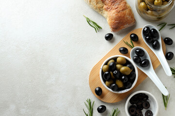 Olives in bowls with bread and spices