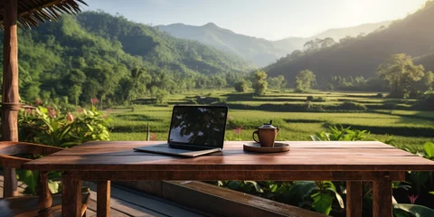 Gordijnen Paddy fields, a wooden table with a plant vase, a blank laptop screen, and a landscape © Coosh448