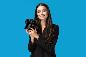 Girl with a gift on a blue background.