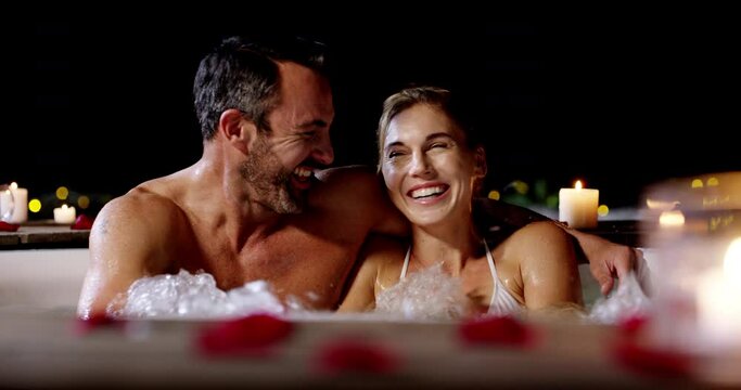 Love, hot tub and happy couple laugh, talk or bond on Valetines Day date, anniversary or funny honeymoon communication. Joke, comedy conversation or relax husband, wife or people hug in night jacuzzi