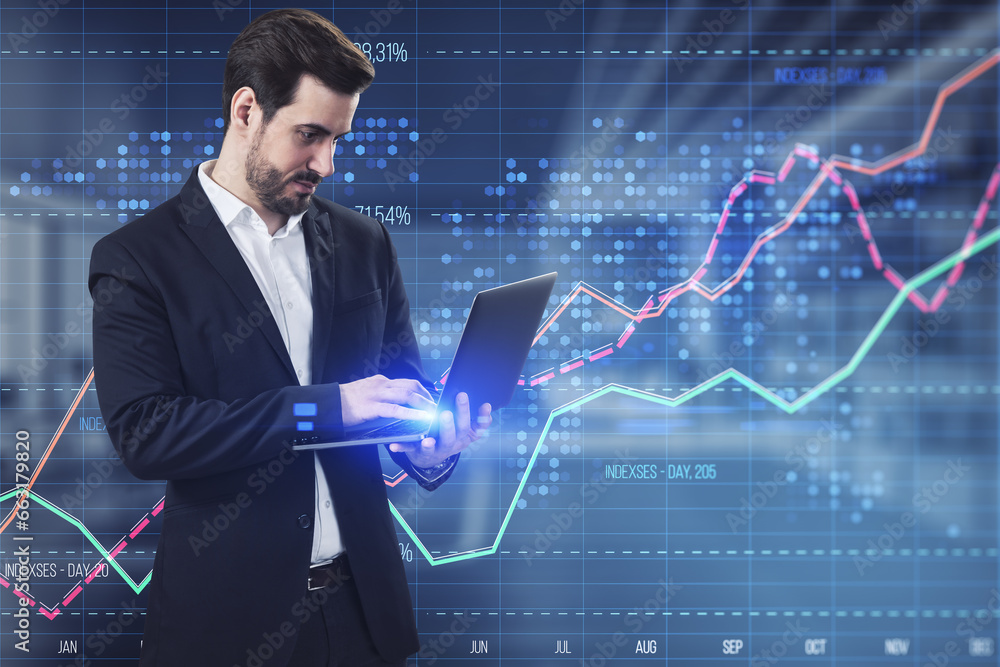 Aufkleber attractive young businessman using laptop with creative business graph with index and grid on blurry