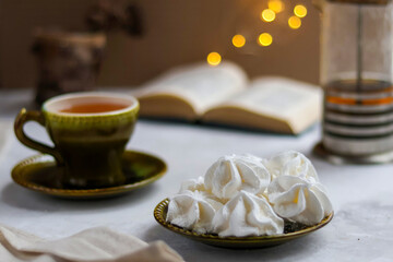 Christmas tea party with marshmallows. book is in unfolded form. hygge, coziness, comfort, winter lifestyle - Powered by Adobe