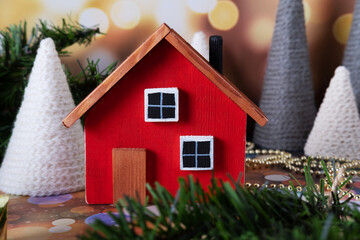 Red wooden toy house on christmas background. Christmas Arrangement
