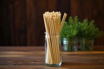bamboo straws neatly arranged on a wooden table