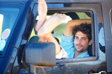 Road trip, man or feet on window of transport for relax, peace and adventure with travel or destination. Person, tourist or traveler with chilling on vacation, holiday or traveling journey in nature