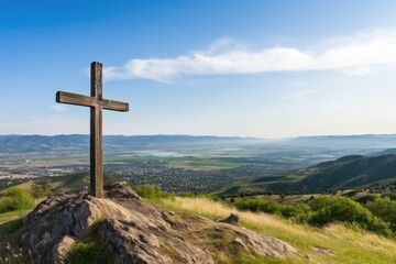 cross on a hill overlooking a valley