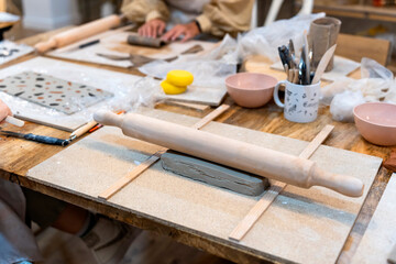 Ceramic Workshop. Clay rolling pin. Work table.
