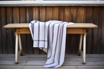 Fototapeta na wymiar tallit draped over a wooden bench