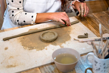 Ceramic Workshop. Close-up of a woman's hands working with clay.
