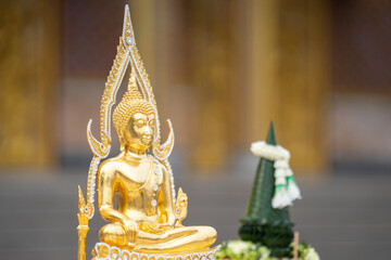 A stunning golden Buddha sculpture, exemplifying the deep reverence and devotion of Thai individuals in their spiritual worship.