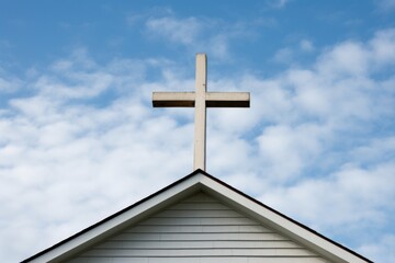 close-up of cross atop large church roof