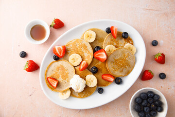 Homemade pancakes with banana and berries