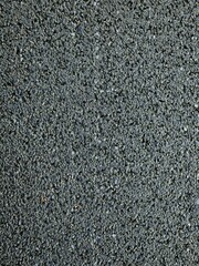 Asphalt, black stone texture as background, copy space for text