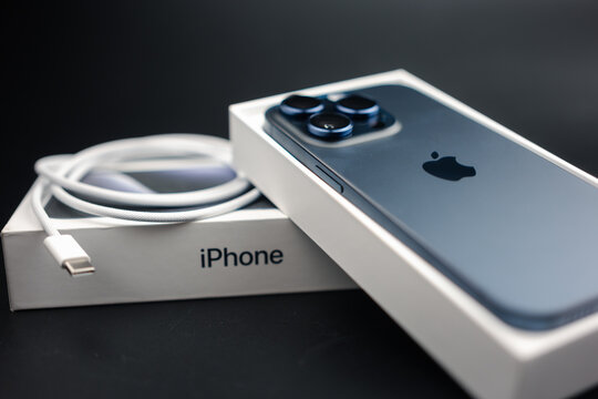 Bangkok, Thailand - October 17, 2023: iPhone 15 Pro Blue Titanium. A tech smartphone modern design and box with usb type-c cable. New cable standard for Apple's devices. Apple's gadgets.
